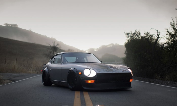 Modified Datsun 240Z on a foggy road