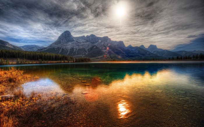HDR mountain lake reflection with sun