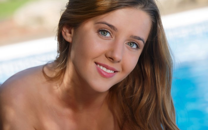 Smiling Sybil by the Swimming Pool