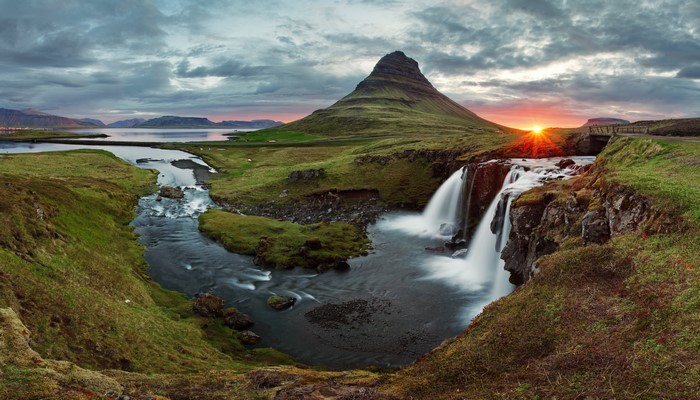Kirkjufell mountain and waterfall at sunset in Iceland