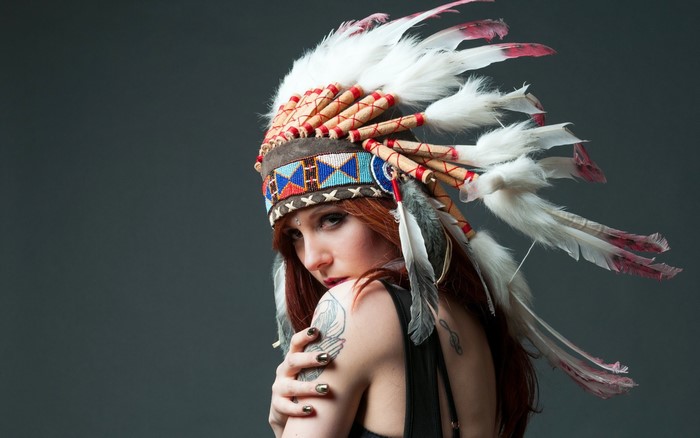 Woman wearing a Native American headdress