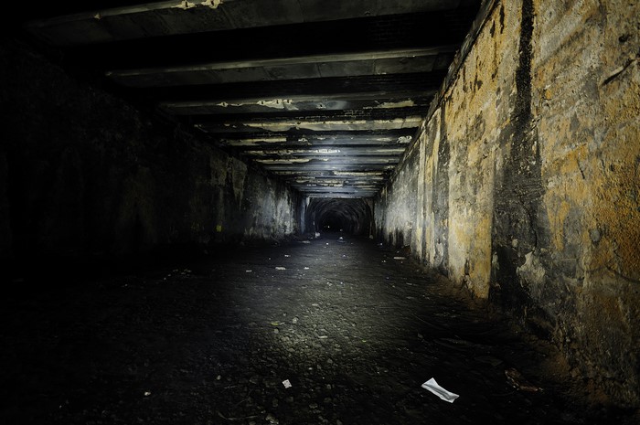Dark tunnel with flashlight illumination