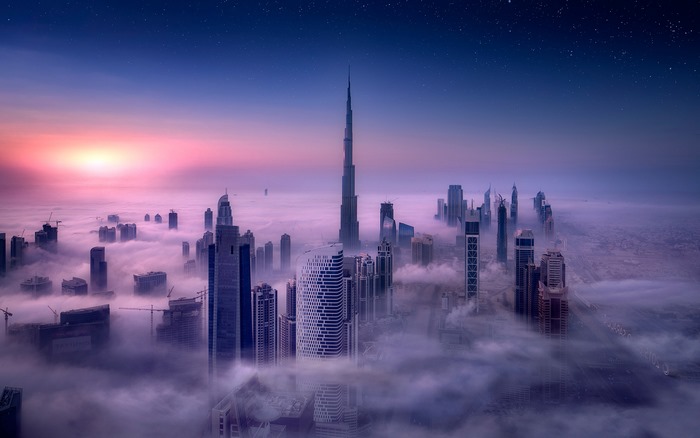 Sunrise over Dubai with Burj Khalifa and Misty Skyscrapers