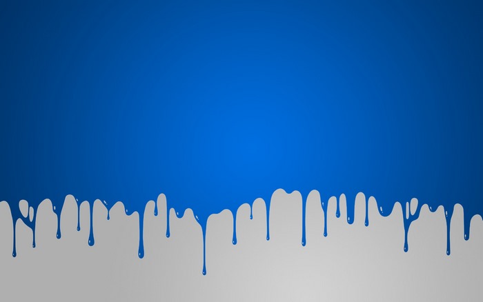 Blue paint dripping on a gray surface
