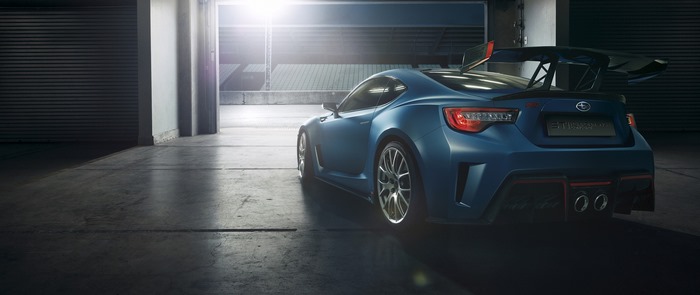 Blue Subaru sports car with large rear spoiler