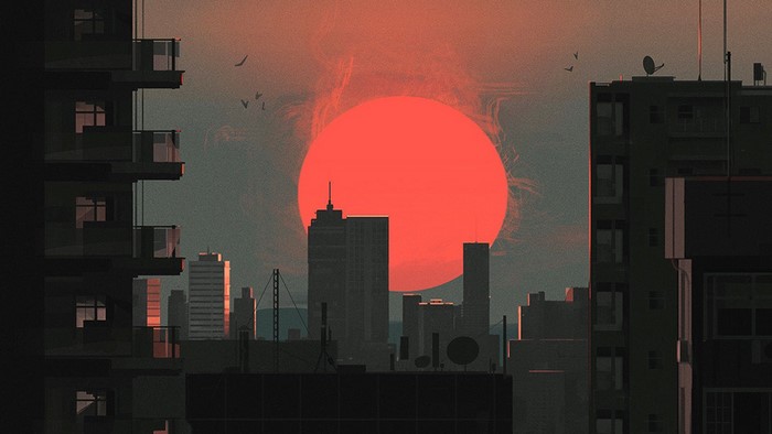 Cityscape at sunset with large red sun