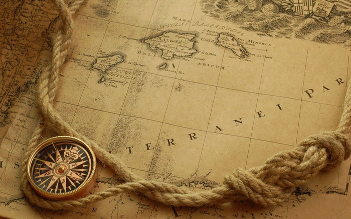 Old map with compass and rope