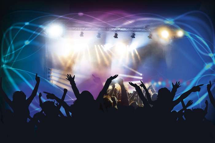 Concert crowd with stage lights and abstract patterns