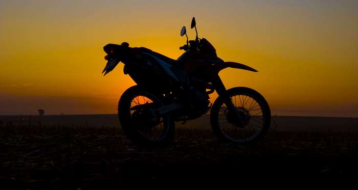 Honda XR 250 motorcycle silhouette at sunset