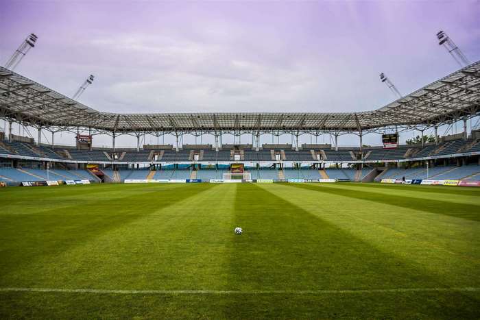 Soccer stadium with a ball on the field