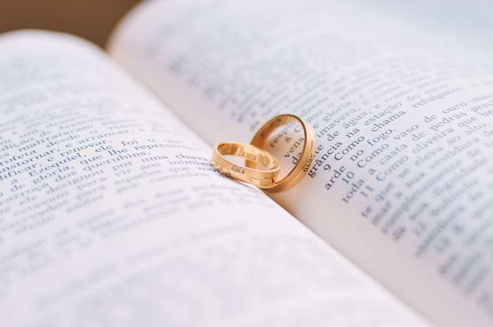 Wedding Rings on Open Book
