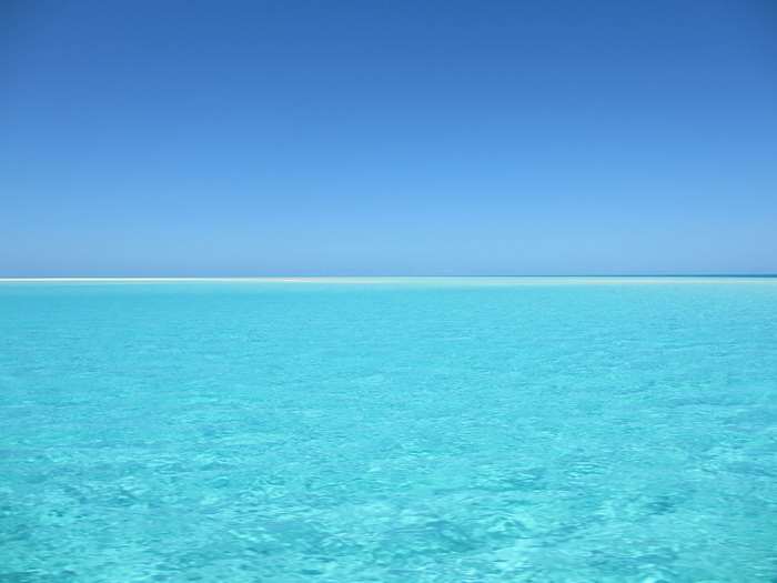 Turquoise ocean under a clear blue sky