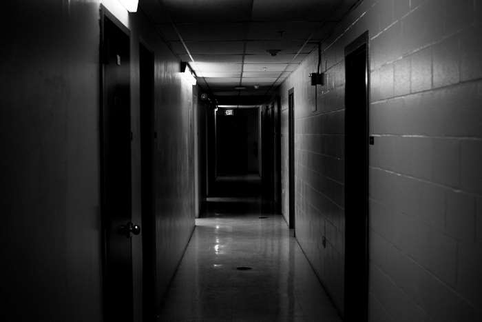 Dark Hallway with Exit Sign