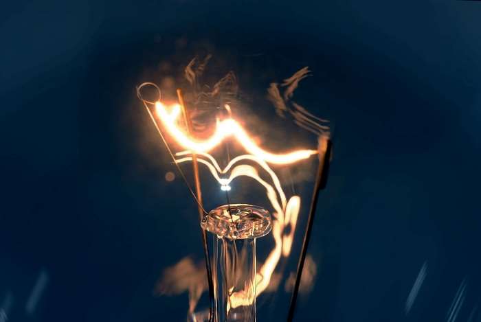Close-up of a glowing light bulb filament