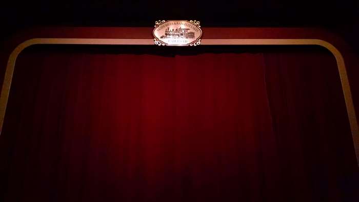 Theater curtain with railroad logo