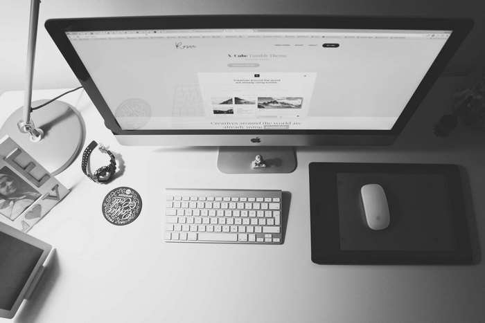Minimalist Mac workspace with keyboard and mouse