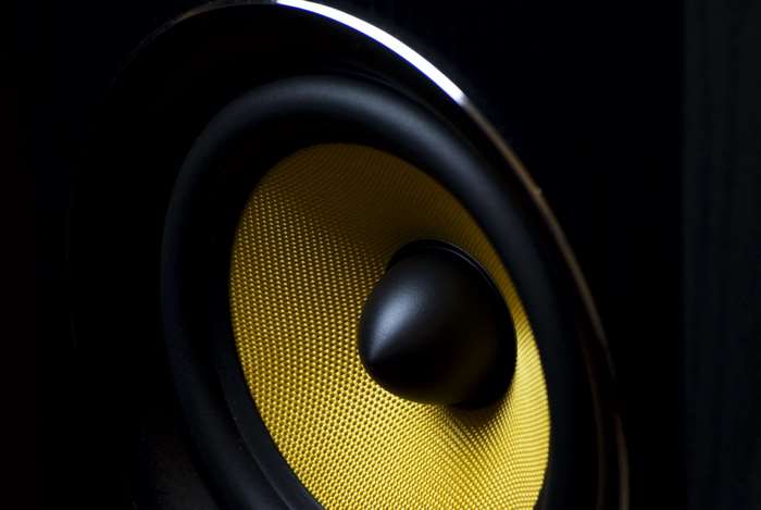 Close-up of a yellow speaker cone