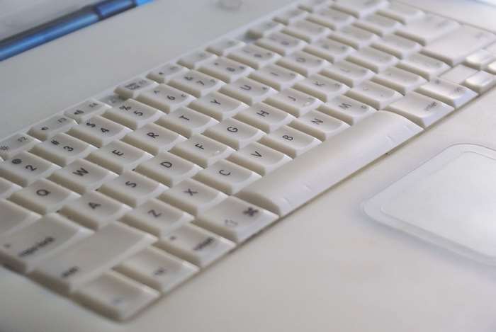 White Apple iBook laptop keyboard and trackpad
