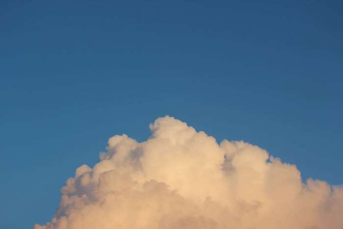 Minimalist cloud on blue sky 4K