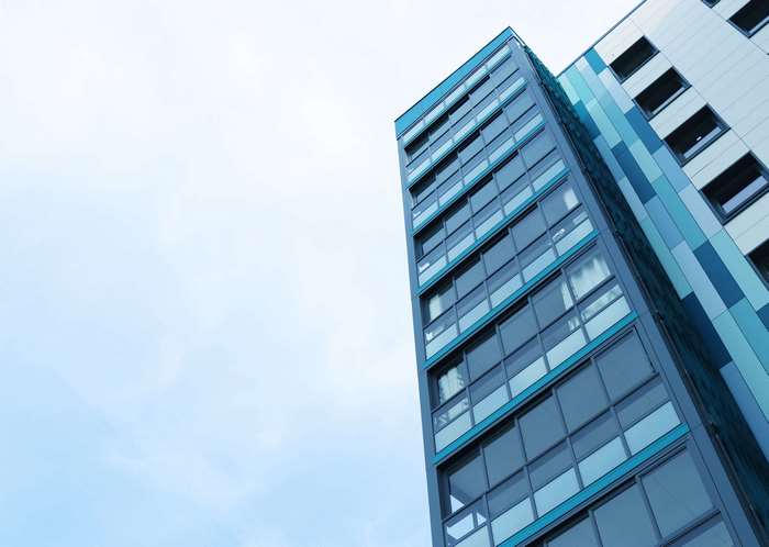 Modern apartment building with blue accents