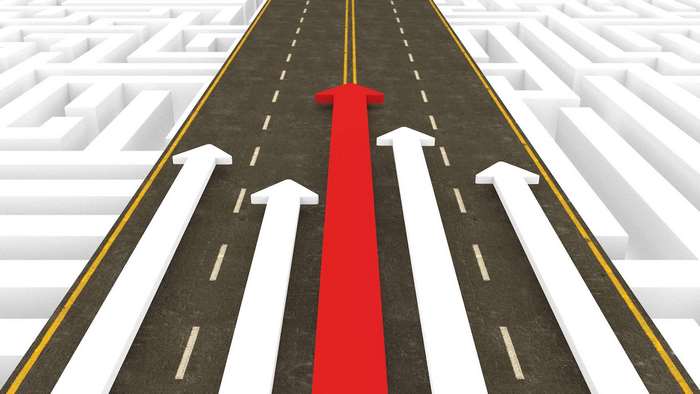 Road with arrows through a maze representing business strategy