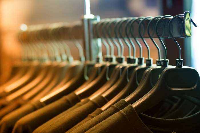 Clothes on hangers on a rack