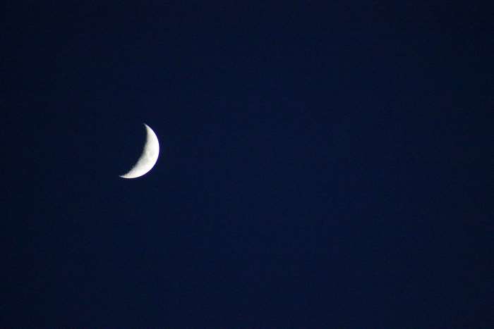 Crescent moon in a dark blue sky