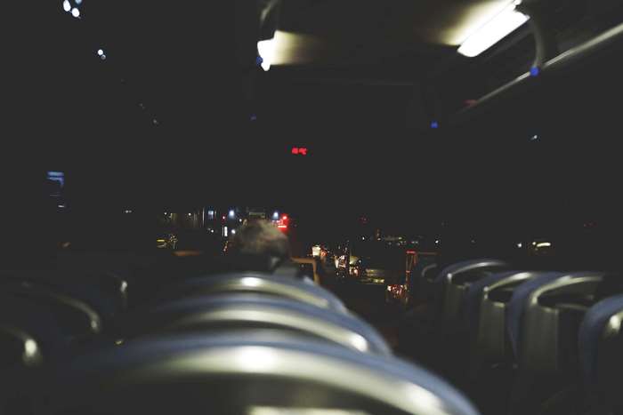 Night bus ride with city lights