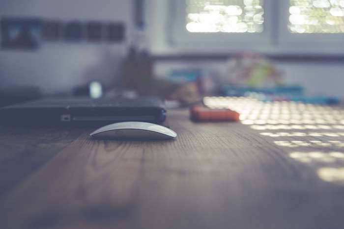 Desk with laptop and mouse, office workspace 4K
