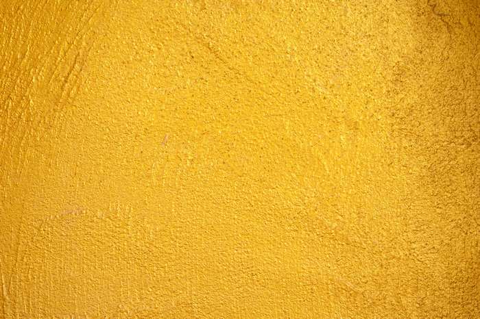 Gold textured surface with visible brush strokes