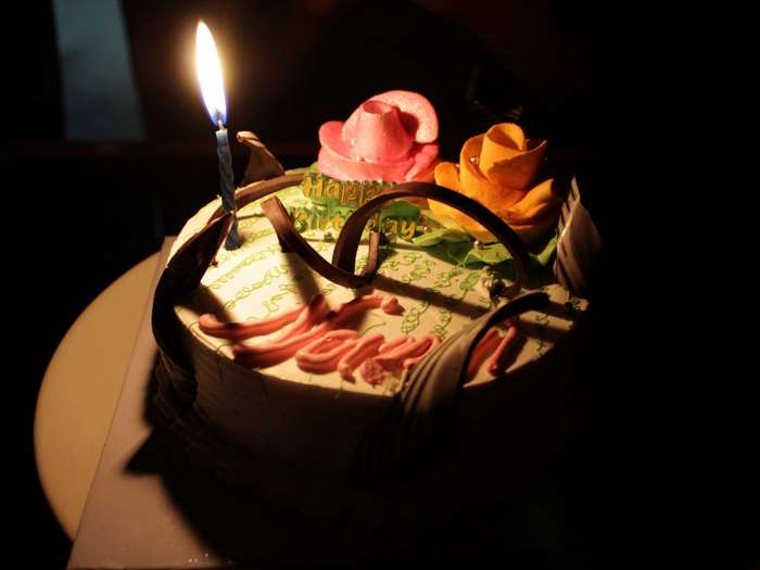 Birthday cake with candle and roses 4K