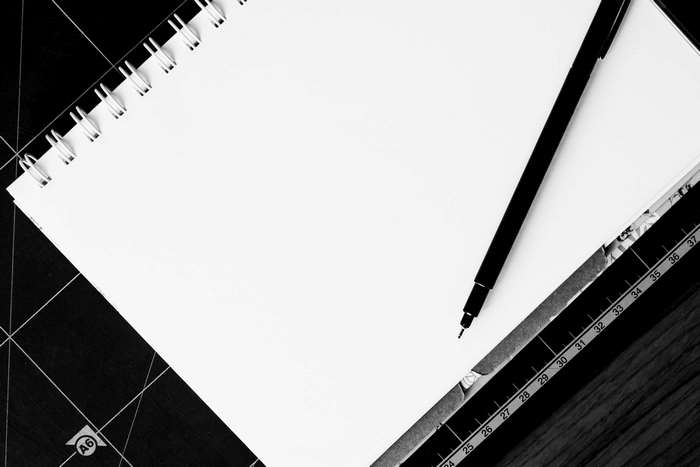 Blank notebook with pen and ruler