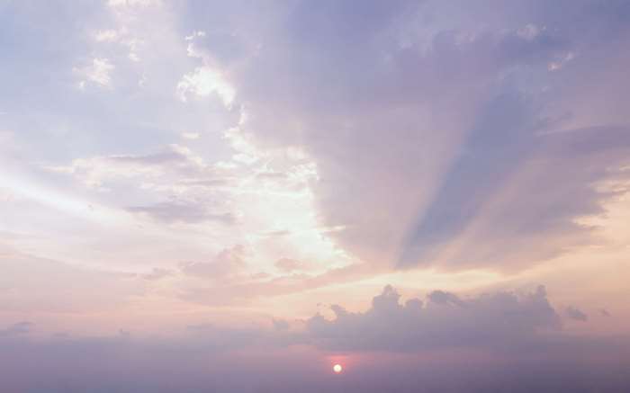 Sunset with crepuscular rays and clouds
