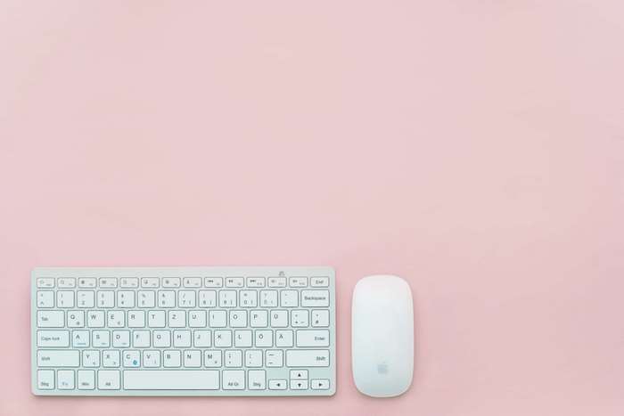 Apple Keyboard and Mouse on Pink Background 4K