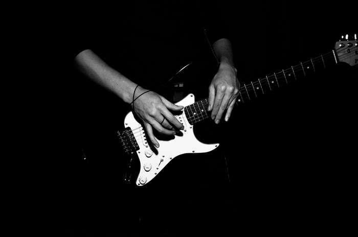 Musician playing an electric guitar
