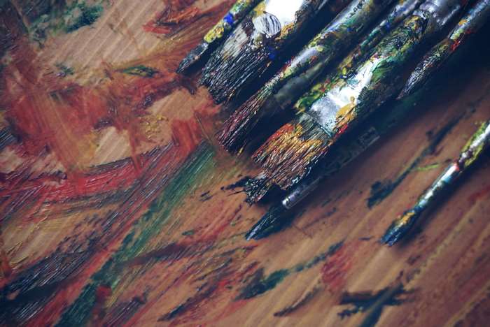 Paint Brushes on Colorful Canvas 4K