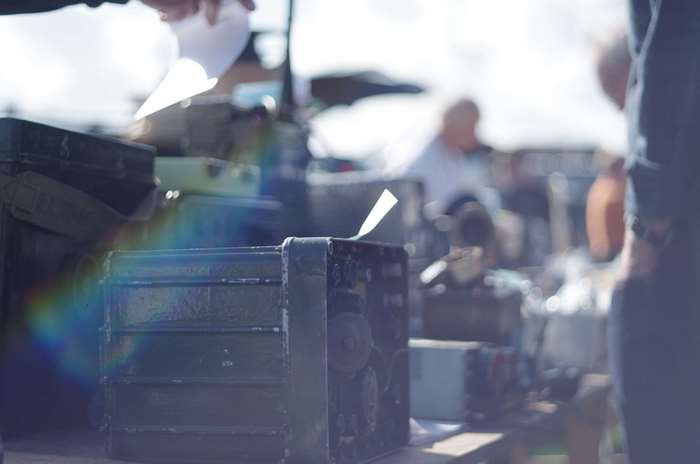 Vintage military radio equipment at a market