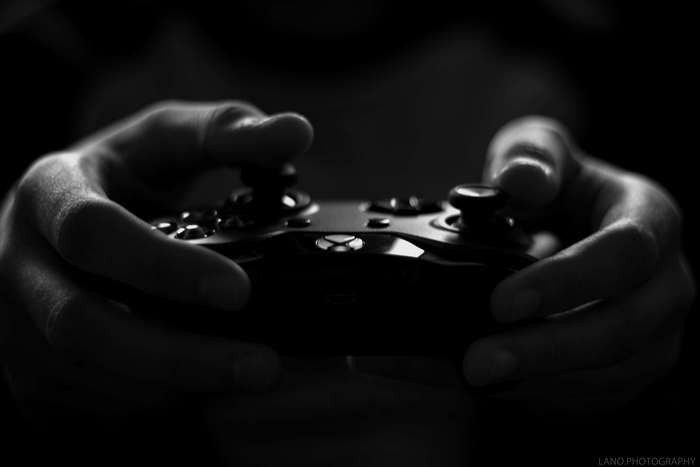Hands holding an Xbox game controller