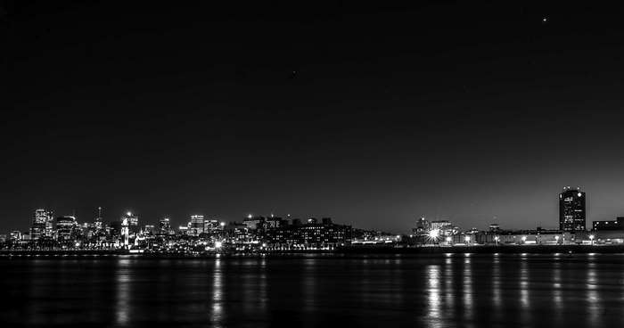 Cityscape at night with reflections on the water