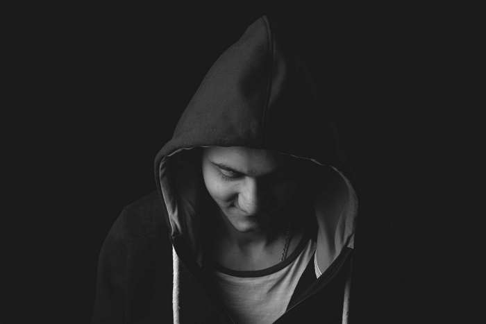 Man wearing a hoodie in black and white