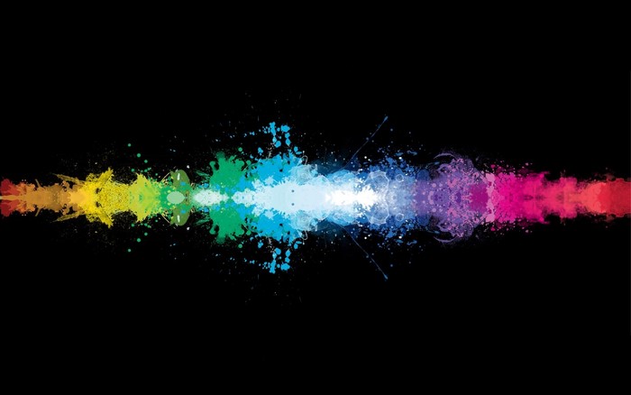Colorful paint splatters in a line on black background