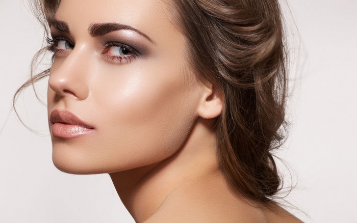 Elegant Brunette Woman with Makeup and Soft Lighting