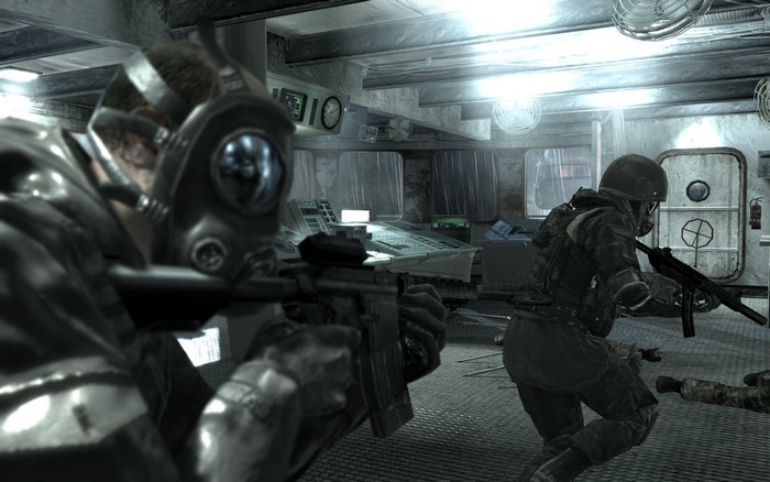 Soldiers in gas masks with automatic weapons in a room