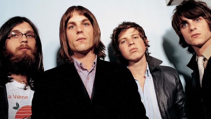 Kings of Leon band members posing