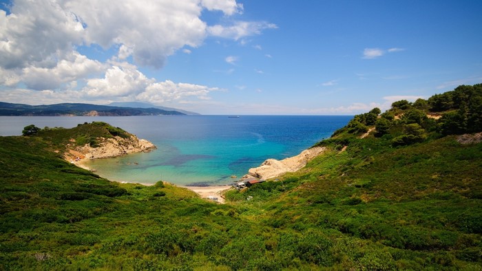 Scenic bay with green hills and blue sea