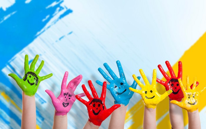 Children's painted hands with smiley faces