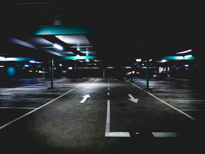 Empty underground parking garage with markings