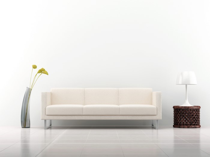 Modern living room with sofa, vase, and lamp