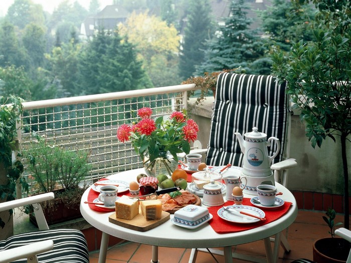 Balcony breakfast with coffee and pastries