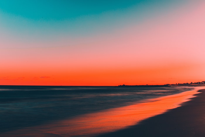 Beach sunset with ocean and colorful sky